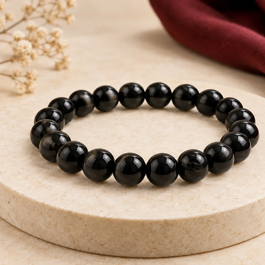 Black Obsidian Bracelet — Polished Glassy Beads — left-framed detail; original illustrative product photography