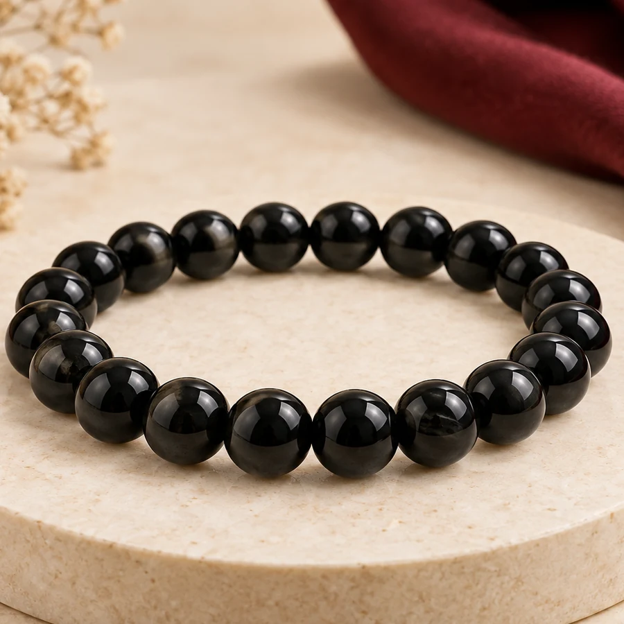 Black Obsidian Bracelet — Polished Glassy Beads — macro material detail; original illustrative product photography